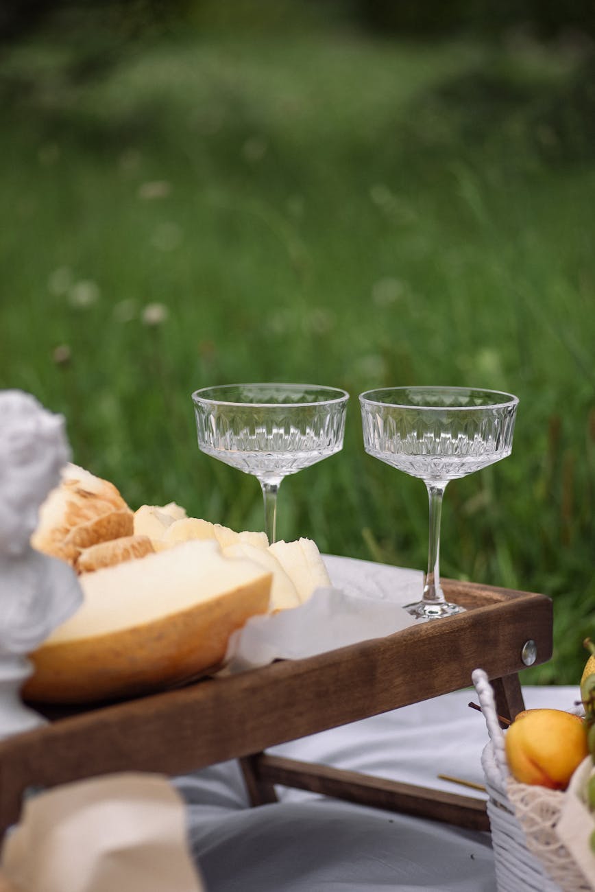 empty wine glasses set on picnic tray